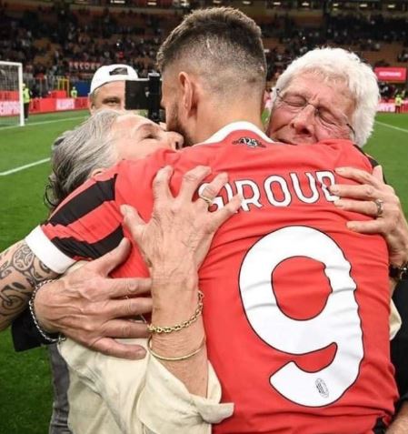 Jean-Pierre Giroud and wife Veronique Giroud hugging their son Olivier Giroud after his match with AC Milan